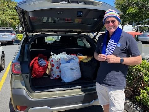 Ross Nicholls from the Mission to Seafarers Brisbane proudly modelling a beanie and scarf from our member donations for 2025