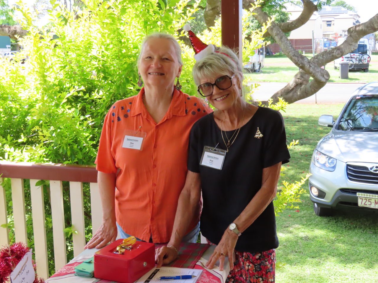 Good Cause Santa Claus December Catch up at the Childers CWA Cottage. Des & Kaz greeting guests.