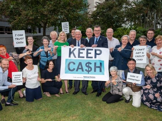 NSA Campaign to KEEP CASH. Brisbane, May 2024. CEO Chris Grice and founding member Everald Compton with Six New Farm Branch members, and other supporters.